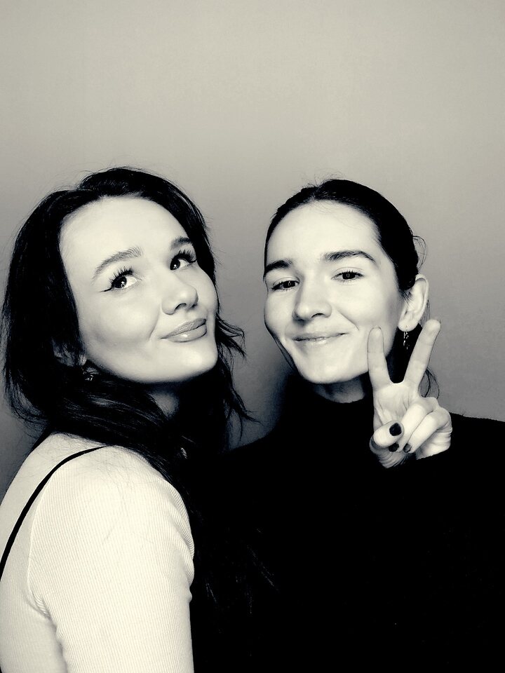 Two guests posing for a monochrome Glam photo