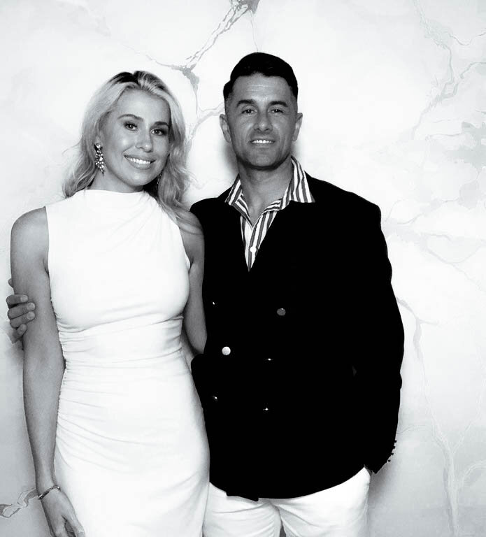 Guests posing for a black and white Glam photo