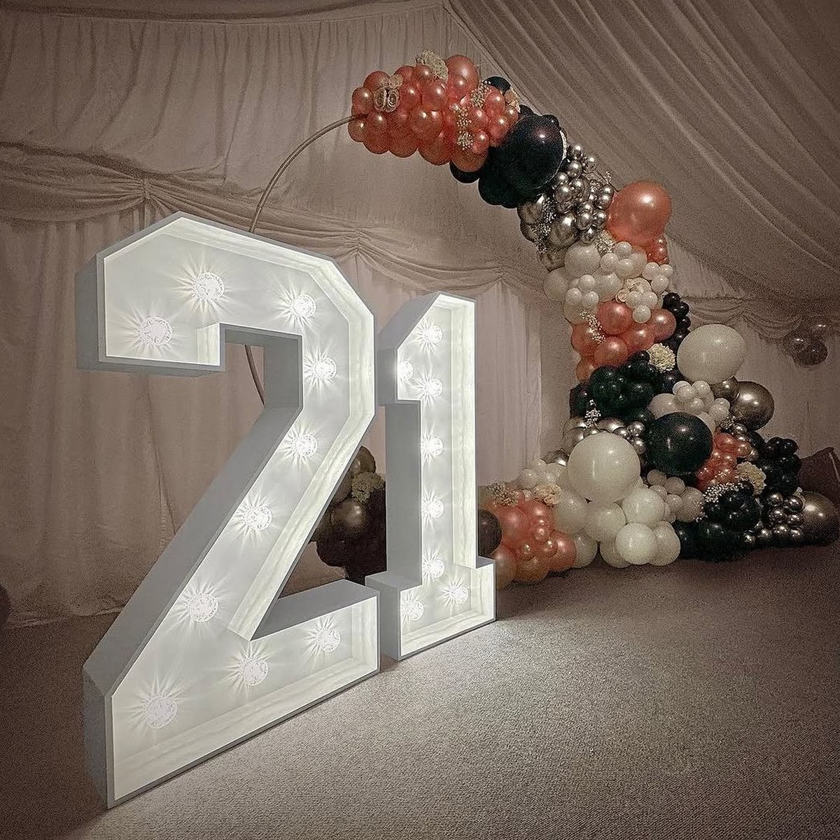 Illuminated 4ft marquee numbers at a birthday celebration